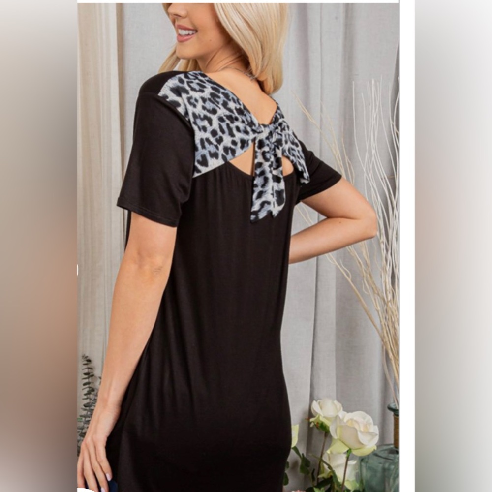 Black top with an animal print tie, back size small